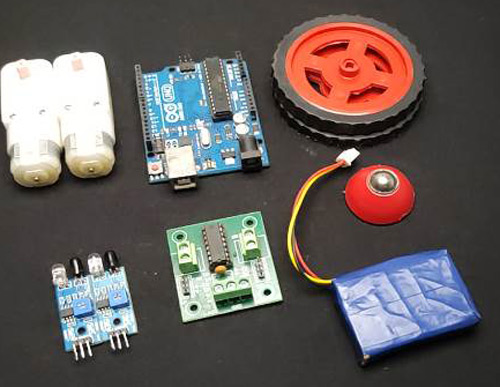 Image showing components required to build a line follower robot